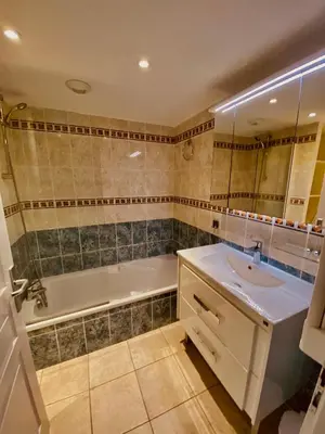 a bathroom with a tub and a sink and a shower at AJACCIO les iles sanguinaires in Ajaccio
