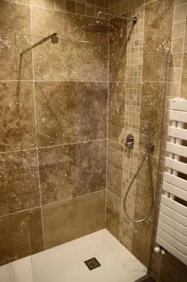 a shower with a glass door in a bathroom at AjaccioPanoramicView in Ajaccio