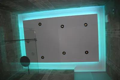 a bathroom with a blue light on a wall at AjaccioPanoramicView in Ajaccio