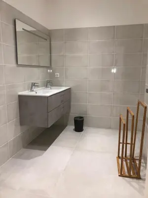 a bathroom with a sink and a mirror at Villa Cargese in Cargèse