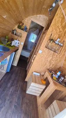 an overhead view of a kitchen in a tiny house at Gîte atypique Le Pod au coeur du maquis in Carbuccia