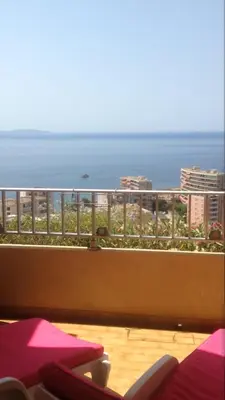 a balcony with a view of the ocean at T2 Sanguinaires calme et cosy, entre mer et maquis in Ajaccio