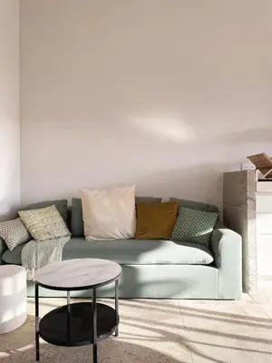 a living room with a couch and a table at A Casa di Santa Giulia in Porto-Vecchio