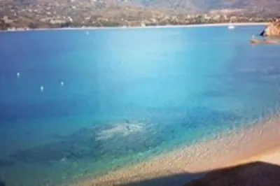 a view of a beach with a body of water at Appartement T2 terrasse vue mer à 180 in Propriano