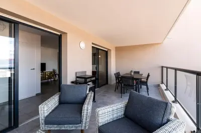 a living room with chairs and a table at Les Rivages De Stagnola - Vue Mer et Plages à Pied in Pietrosella