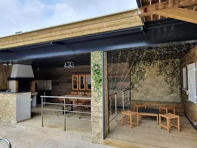 an outdoor patio with a table and chairs at Isula Bella in Prunelli-di-Fiumorbo