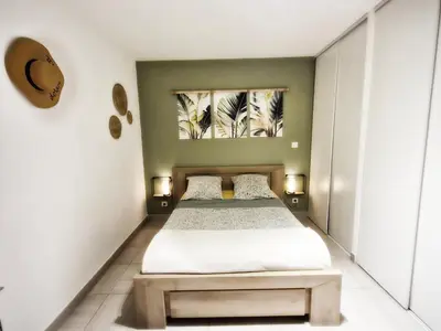 a room with two bunk beds and a mirror at Isula Bella in Prunelli-di-Fiumorbo