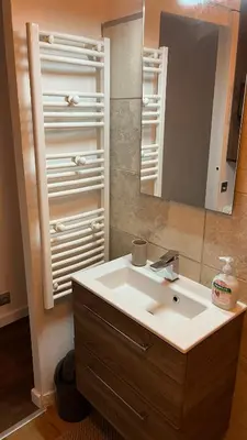 a bathroom with a white sink and a mirror at Marina'home in Ajaccio