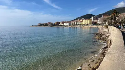 a view of a beach with buildings and the water at Marina'home in Ajaccio