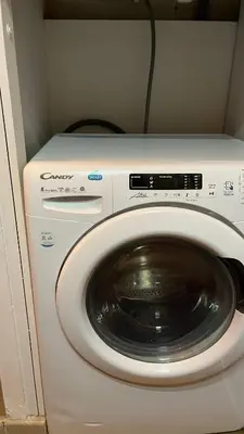 a washer and dryer in a small room at Marina'home in Ajaccio