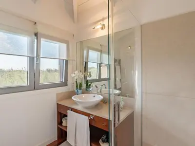 a bathroom with a sink and a glass shower at Holiday Home Villa Lavezzi by Interhome in Bonifacio
