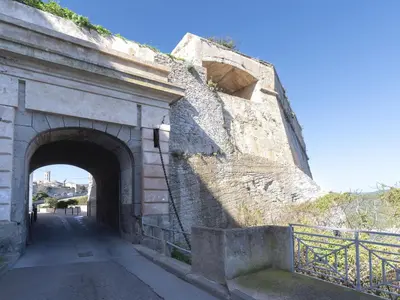 a stone bridge with an entrance to a tunnel at Holiday Home Villa Lavezzi by Interhome in Bonifacio