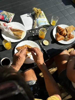a tent in a park with trees and rocks at Camping La Baie des Voiles in Porto-Vecchio
