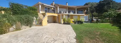 a large yellow house with a driveway at T2 Propriano vue mer, neuf, climatisé et classé 3 étoiles in Viggianello