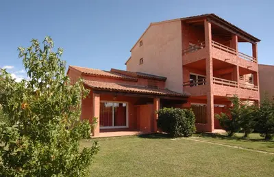 a building with a bunch of bushes and trees at Studio 2 ou 3 people, 150 m beach, near Ghisonaccia in Ghisonaccia