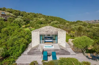 an aerial view of a house with a swimming pool at Hôtel Version Maquis Santa Manza in Bonifacio