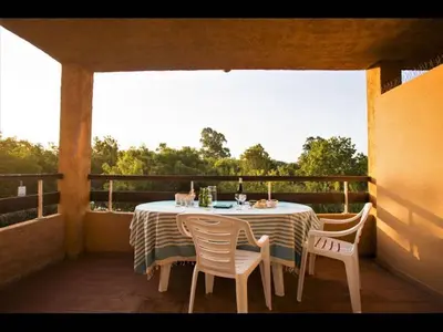 a living room with a couch and a table at Four rooms apartment Ghisonaccia - 150 m from the beach in Ghisonaccia