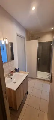 a large bathroom with a sink and a shower at Le Clos des Milans in Rapale