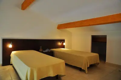 a bedroom with two beds in a room at Résidence Goélia Perla D'Isula in Linguizzetta