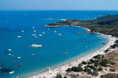 an aerial view of a beach with boats in the water at Air-conditioned apartment near Porto Vecchio, 500 m sea, 8 people, two bathrooms in Zonza