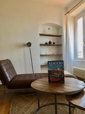 a living room with a leather couch and a coffee table at Chez Andrea, Centre Historique Ajaccio in Ajaccio