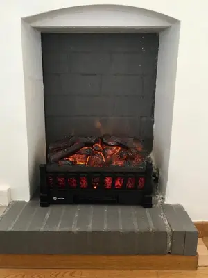 a brick oven with a fire inside of it at Chez Andrea, Centre Historique Ajaccio in Ajaccio