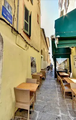 a row of tables and chairs outside of a restaurant at Chez Andrea, Centre Historique Ajaccio in Ajaccio