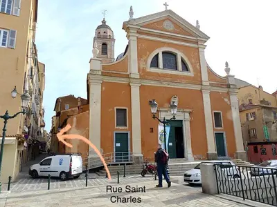 a man is standing in front of a church at Chez Andrea, Centre Historique Ajaccio in Ajaccio