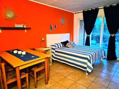 a living room with a table with food on it at Studio 2 people - 150 m from de sea - Ghisonaccia in Ghisonaccia