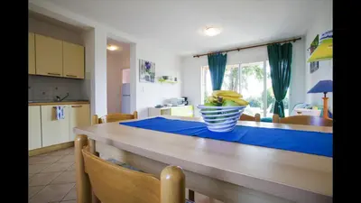 a living room with a couch and a table at Studio 2 people - 150 m from de sea - Ghisonaccia in Ghisonaccia