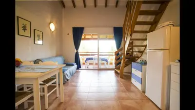 a beach with footprints in the sand and the ocean at Marina Corsa Residence 3rooms apartment 150 m from the beach - Ghisonaccia in Ghisonaccia
