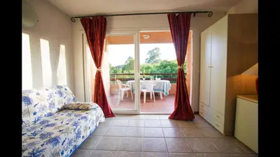 a park with green grass and palm trees at Marina Corsa Residence 3rooms apartment 150 m from the beach - Ghisonaccia in Ghisonaccia