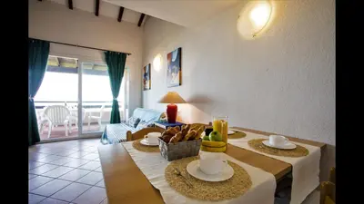 a living room with a table with food on it at Marina Corsa Residence Three rooms apartment 150 m from the beach - Ghisonaccia in Ghisonaccia