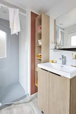 a bathroom with a sink and a shower at Camping Porto Vecchio in Porto-Vecchio