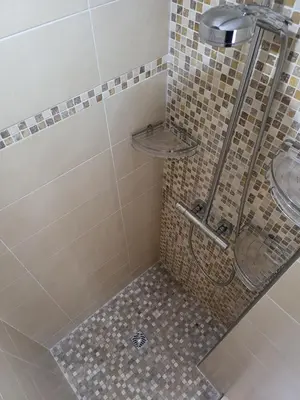 a bathroom with a shower with a glass door at Christelle in Propriano