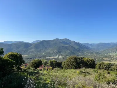a view of a valley with mountains in the background at Tradition Corse & Modernité Ì Caseddi dì Barabè Appartement A Cantina in Granace