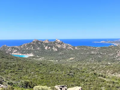a view of the ocean from the top of a mountain at Tradition Corse & Modernité Ì Caseddi dì Barabè Appartement A Cantina in Granace