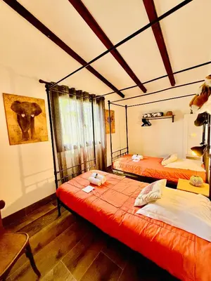 a room with two beds and a window in it at Casamarina2a Maisons bord de mer in Ghisonaccia