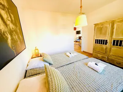 a bedroom with two beds with towels on them at Casamarina2a Maisons bord de mer in Ghisonaccia