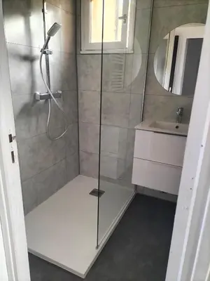a shower with a glass door in a bathroom at T2 vue mer à Porticcio, proche aéroport Ajaccio in Porticcio