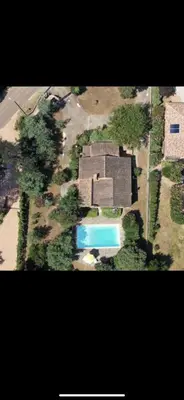 an aerial view of a house with a swimming pool at Villa privée dans un cadre verdoyant , piscine et grand jardin in Porto-Vecchio