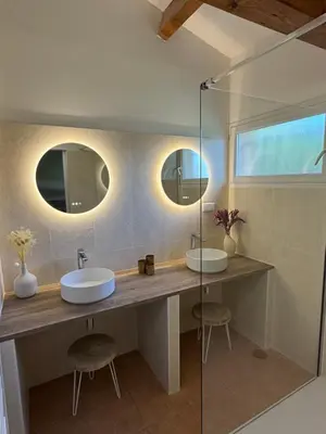a bathroom with a sink and a mirror and a tub at CALA CORSICA - Villas 5 Etoiles T5 Piscine privée - Villa T4 Piscine privée chauffée - Villa T3 Piscine partagée - Internet Fibre - Entièrement Climatisée à Lecci de Porto-Vecchio Cala Rossa in Lecci