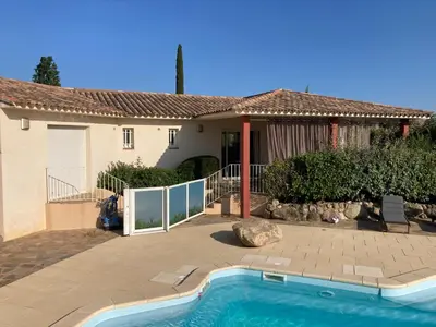 a house with a swimming pool in front of a house at CALA CORSICA - Villas 5 Etoiles T5 Piscine privée - Villa T4 Piscine privée chauffée - Villa T3 Piscine partagée - Internet Fibre - Entièrement Climatisée à Lecci de Porto-Vecchio Cala Rossa in Lecci