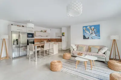 a living room with a couch and a table at Le Luciani in Coti-Chiavari