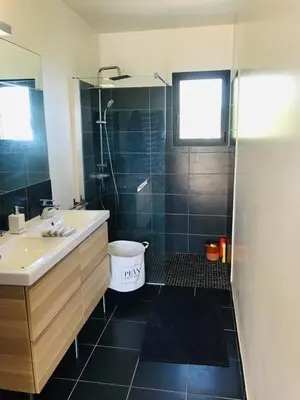 a bathroom with a tub and a sink and a shower at Villa Poggio in Santa-Maria-Poggio