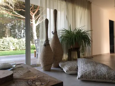 two vases sitting on a table in front of a window at A MUREDDA in Bonifacio