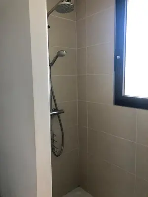 a shower with a shower head in a bathroom at Appartement les pieds dans l'eau 3 Chambres - Propriano - Corse in Propriano