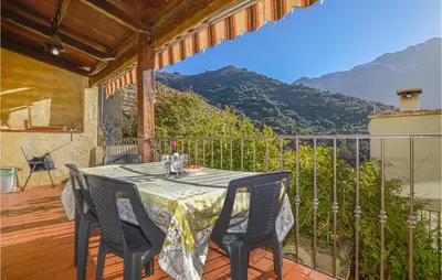 a table and chairs on a balcony with a view at Lovely Home In Montegrosso With Wifi in Montegrosso