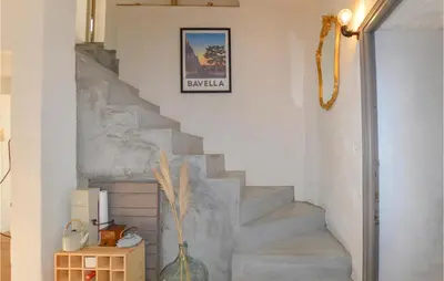 a stairway with a vase in a room at Lovely Home In Montegrosso With Wifi in Montegrosso