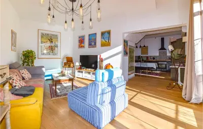 a living room with a couch and a chair at Lovely Home In Montegrosso With Wifi in Montegrosso